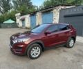 Красный Хендай Туксон, объемом двигателя 2 л и пробегом 125 тыс. км за 15900 $, фото 1 на Automoto.ua