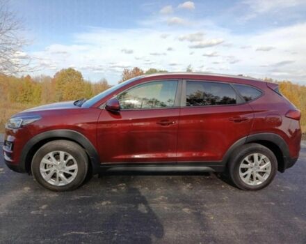 Червоний Хендай Туксон, об'ємом двигуна 2 л та пробігом 74 тис. км за 9600 $, фото 3 на Automoto.ua