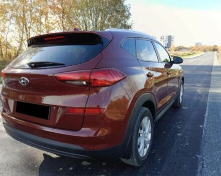 Красный Хендай Туксон, объемом двигателя 2 л и пробегом 130 тыс. км за 13000 $, фото 5 на Automoto.ua