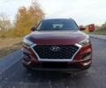 Красный Хендай Туксон, объемом двигателя 2 л и пробегом 130 тыс. км за 13000 $, фото 1 на Automoto.ua