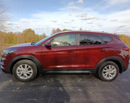 Красный Хендай Туксон, объемом двигателя 2 л и пробегом 130 тыс. км за 13000 $, фото 8 на Automoto.ua