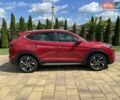Красный Хендай Туксон, объемом двигателя 2 л и пробегом 30 тыс. км за 31000 $, фото 4 на Automoto.ua