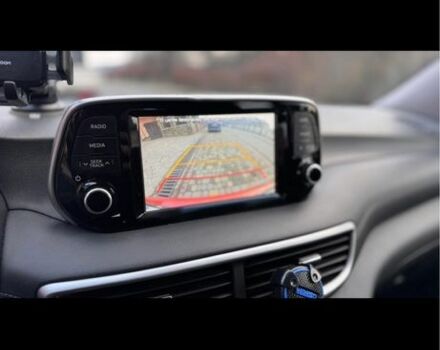 Красный Хендай Туксон, объемом двигателя 2 л и пробегом 70 тыс. км за 20000 $, фото 6 на Automoto.ua