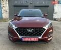 Красный Хендай Туксон, объемом двигателя 2 л и пробегом 119 тыс. км за 15500 $, фото 1 на Automoto.ua