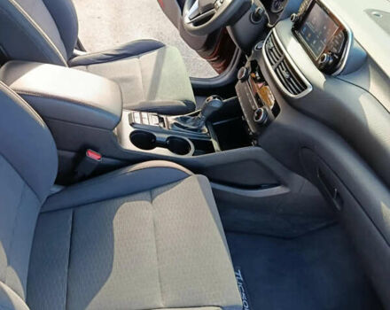 Красный Хендай Туксон, объемом двигателя 2 л и пробегом 97 тыс. км за 20000 $, фото 10 на Automoto.ua