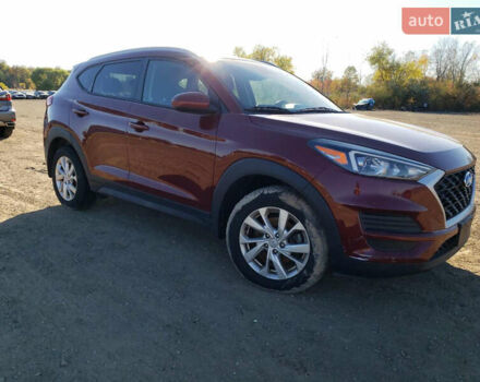 Красный Хендай Туксон, объемом двигателя 2 л и пробегом 71 тыс. км за 13300 $, фото 3 на Automoto.ua