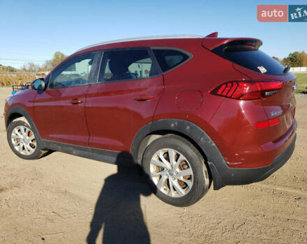 Красный Хендай Туксон, объемом двигателя 2 л и пробегом 71 тыс. км за 13300 $, фото 1 на Automoto.ua