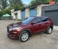 Красный Хендай Туксон, объемом двигателя 2 л и пробегом 119 тыс. км за 15500 $, фото 5 на Automoto.ua