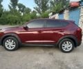 Красный Хендай Туксон, объемом двигателя 2 л и пробегом 119 тыс. км за 15500 $, фото 4 на Automoto.ua