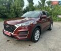 Красный Хендай Туксон, объемом двигателя 2 л и пробегом 119 тыс. км за 15500 $, фото 6 на Automoto.ua