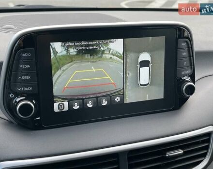 Красный Хендай Туксон, объемом двигателя 2 л и пробегом 64 тыс. км за 30500 $, фото 25 на Automoto.ua