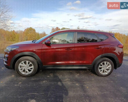 Красный Хендай Туксон, объемом двигателя 2 л и пробегом 97 тыс. км за 20000 $, фото 7 на Automoto.ua