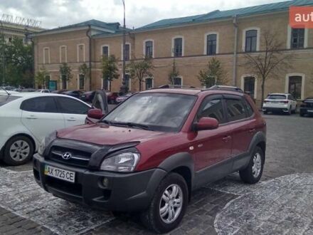 Красный Хендай Туксон, объемом двигателя 1.98 л и пробегом 231 тыс. км за 8500 $, фото 1 на Automoto.ua