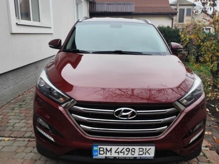 Красный Хендай Туксон, объемом двигателя 2 л и пробегом 110 тыс. км за 19800 $, фото 1 на Automoto.ua
