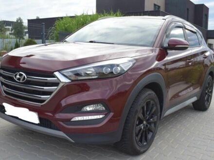 Красный Хендай Туксон, объемом двигателя 2 л и пробегом 117 тыс. км за 10300 $, фото 1 на Automoto.ua