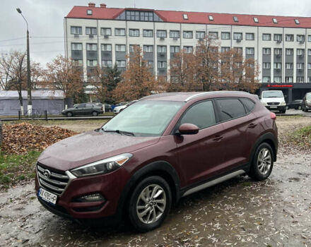 Красный Хендай Туксон, объемом двигателя 2 л и пробегом 150 тыс. км за 13300 $, фото 1 на Automoto.ua