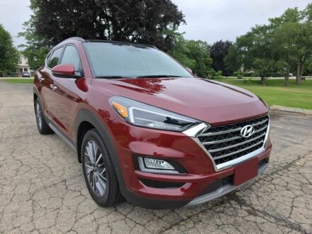 Красный Хендай Туксон, объемом двигателя 2.4 л и пробегом 38 тыс. км за 11100 $, фото 1 на Automoto.ua