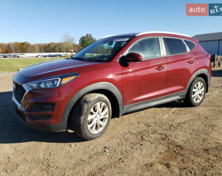 Красный Хендай Туксон, объемом двигателя 2 л и пробегом 71 тыс. км за 13300 $, фото 1 на Automoto.ua