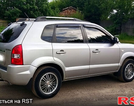 Серый Хендай Туксон, объемом двигателя 2 л и пробегом 249 тыс. км за 7550 $, фото 2 на Automoto.ua