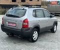 Серый Хендай Туксон, объемом двигателя 1.98 л и пробегом 243 тыс. км за 7100 $, фото 4 на Automoto.ua