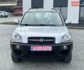 Серый Хендай Туксон, объемом двигателя 1.98 л и пробегом 243 тыс. км за 7100 $, фото 1 на Automoto.ua