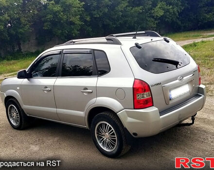 Серый Хендай Туксон, объемом двигателя 2 л и пробегом 249 тыс. км за 7550 $, фото 1 на Automoto.ua