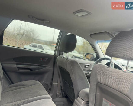 Серый Хендай Туксон, объемом двигателя 1.98 л и пробегом 241 тыс. км за 7000 $, фото 47 на Automoto.ua