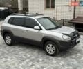 Серый Хендай Туксон, объемом двигателя 1.98 л и пробегом 252 тыс. км за 6950 $, фото 1 на Automoto.ua
