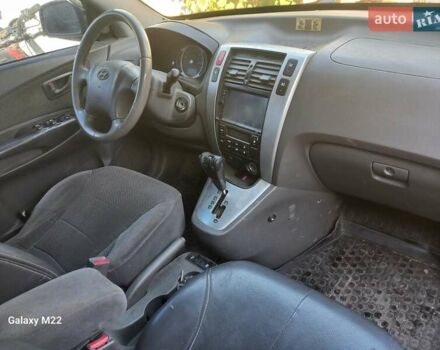 Серый Хендай Туксон, объемом двигателя 1.98 л и пробегом 230 тыс. км за 8500 $, фото 5 на Automoto.ua
