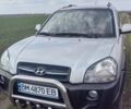 Серый Хендай Туксон, объемом двигателя 1.99 л и пробегом 354 тыс. км за 7500 $, фото 4 на Automoto.ua