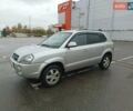 Серый Хендай Туксон, объемом двигателя 1.98 л и пробегом 250 тыс. км за 7300 $, фото 1 на Automoto.ua
