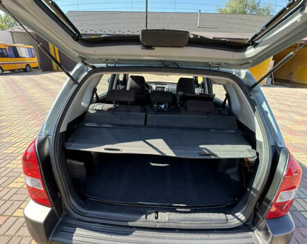 Серый Хендай Туксон, объемом двигателя 1.98 л и пробегом 207 тыс. км за 7050 $, фото 7 на Automoto.ua