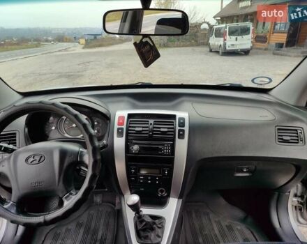 Серый Хендай Туксон, объемом двигателя 1.99 л и пробегом 210 тыс. км за 7900 $, фото 14 на Automoto.ua