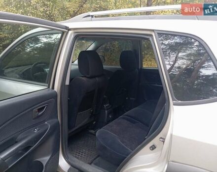 Серый Хендай Туксон, объемом двигателя 1.98 л и пробегом 312 тыс. км за 6000 $, фото 7 на Automoto.ua