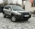 Серый Хендай Туксон, объемом двигателя 1.98 л и пробегом 252 тыс. км за 6950 $, фото 1 на Automoto.ua