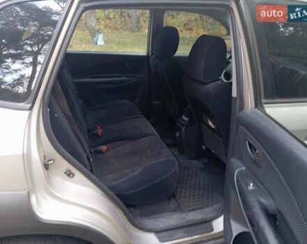 Серый Хендай Туксон, объемом двигателя 1.98 л и пробегом 312 тыс. км за 6000 $, фото 2 на Automoto.ua