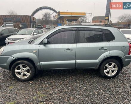 Серый Хендай Туксон, объемом двигателя 1.98 л и пробегом 253 тыс. км за 7650 $, фото 6 на Automoto.ua