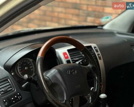 Серый Хендай Туксон, объемом двигателя 2 л и пробегом 271 тыс. км за 7400 $, фото 29 на Automoto.ua