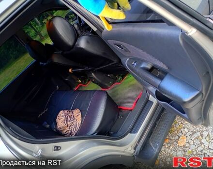 Сірий Хендай Туксон, об'ємом двигуна 2 л та пробігом 300 тис. км за 7500 $, фото 5 на Automoto.ua