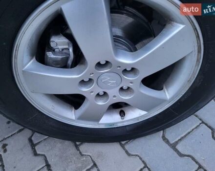 Серый Хендай Туксон, объемом двигателя 2 л и пробегом 240 тыс. км за 8300 $, фото 151 на Automoto.ua