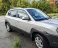 Серый Хендай Туксон, объемом двигателя 1.98 л и пробегом 193 тыс. км за 7700 $, фото 1 на Automoto.ua
