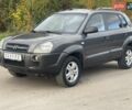 Серый Хендай Туксон, объемом двигателя 1.98 л и пробегом 233 тыс. км за 7700 $, фото 1 на Automoto.ua