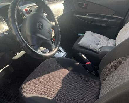 Серый Хендай Туксон, объемом двигателя 2 л и пробегом 161 тыс. км за 7000 $, фото 8 на Automoto.ua