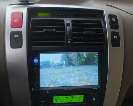 Серый Хендай Туксон, объемом двигателя 1.98 л и пробегом 250 тыс. км за 7300 $, фото 13 на Automoto.ua