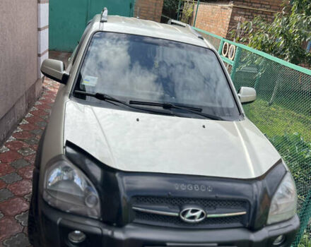 Серый Хендай Туксон, объемом двигателя 1.98 л и пробегом 233 тыс. км за 7800 $, фото 2 на Automoto.ua