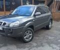 Серый Хендай Туксон, объемом двигателя 1.98 л и пробегом 258 тыс. км за 7500 $, фото 1 на Automoto.ua