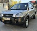 Серый Хендай Туксон, объемом двигателя 1.98 л и пробегом 115 тыс. км за 10950 $, фото 1 на Automoto.ua