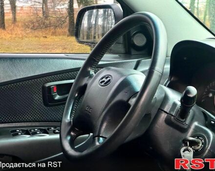 Серый Хендай Туксон, объемом двигателя 20 л и пробегом 170 тыс. км за 7700 $, фото 12 на Automoto.ua