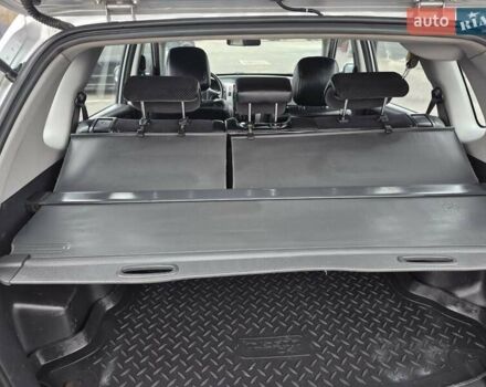 Серый Хендай Туксон, объемом двигателя 1.98 л и пробегом 189 тыс. км за 8300 $, фото 13 на Automoto.ua