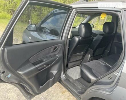 Серый Хендай Туксон, объемом двигателя 2 л и пробегом 175 тыс. км за 9662 $, фото 7 на Automoto.ua